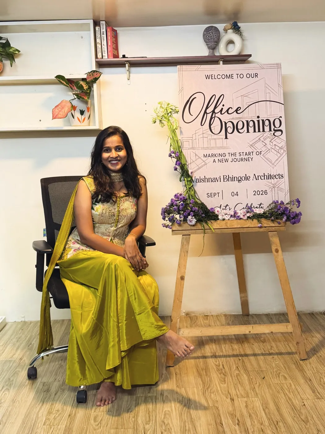 Portrait of Ar. Vaishnavi Bhingole seated beside a floral arrangement